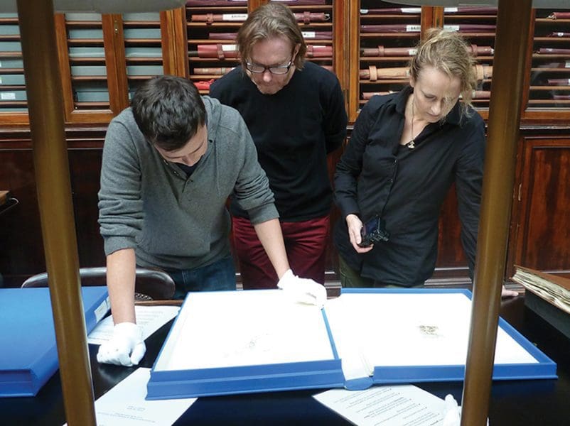 Tom Nicholson, Martin King and Caroline Rothwell viewing old master prints in the British Museum.